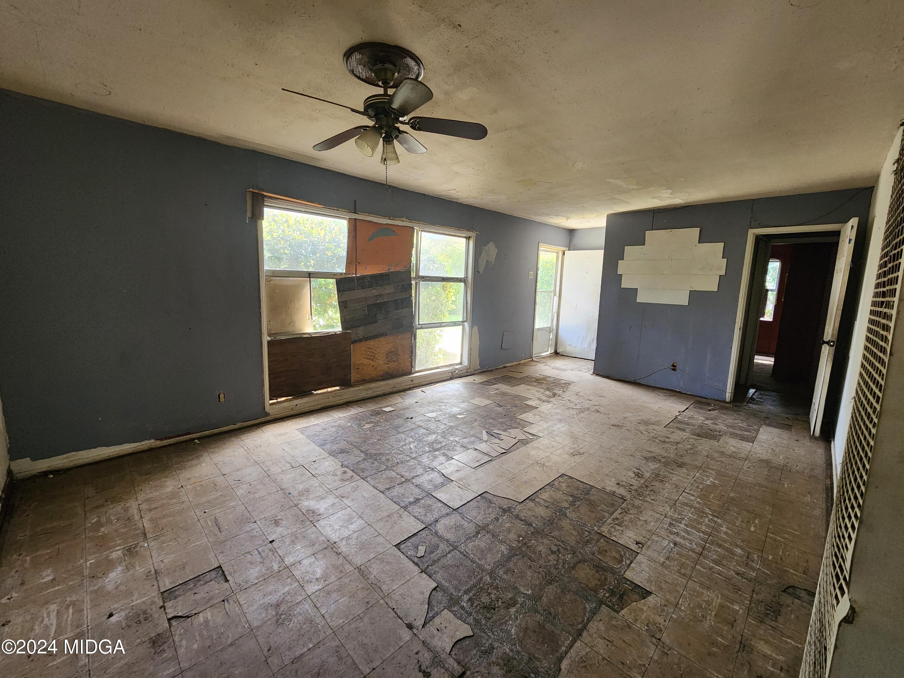 3685 Rice Mill Road Macon, GA 31206 - Photo 4 of 24 a view of empty room with windows