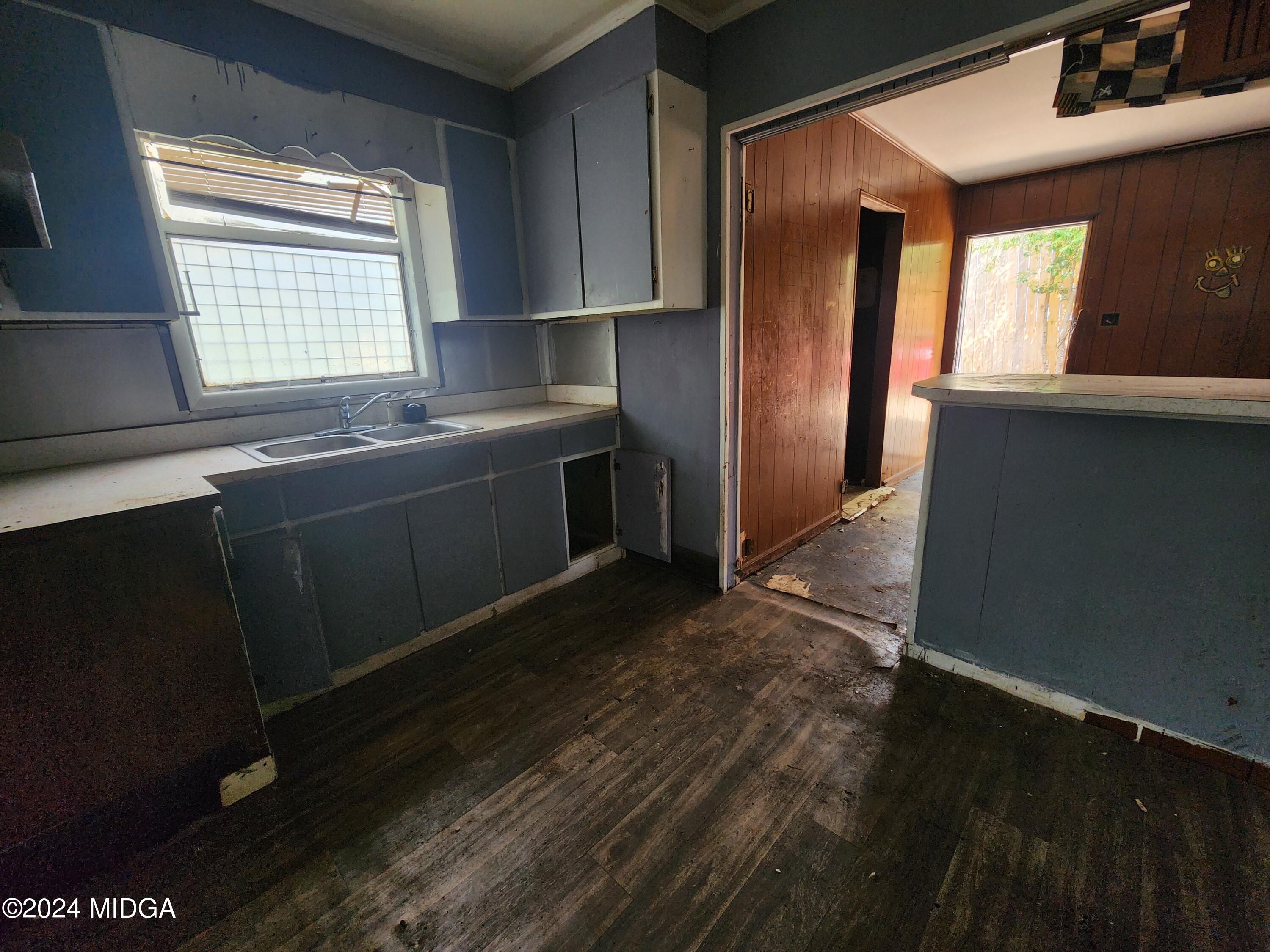 3685 Rice Mill Road Macon, GA 31206 - Photo 7 of 24 a kitchen with granite countertop cabinets stainless steel appliances and a window
