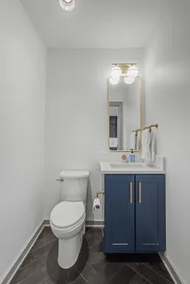 a bedroom with a bed and a mirror