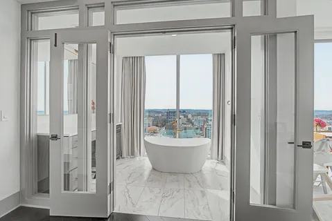 a bath tub sitting next to a bathroom sink