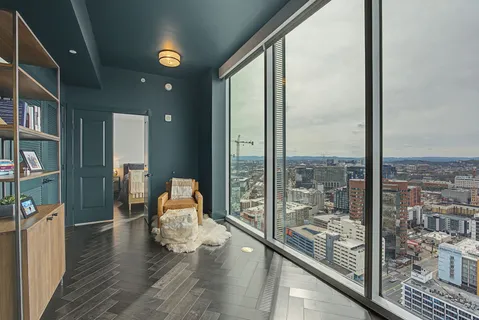 a bedroom with a bed and a couch