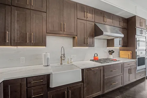 a kitchen that has a lot of cabinets