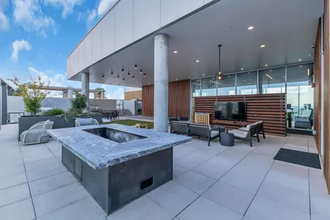 a view of a backyard with sitting area