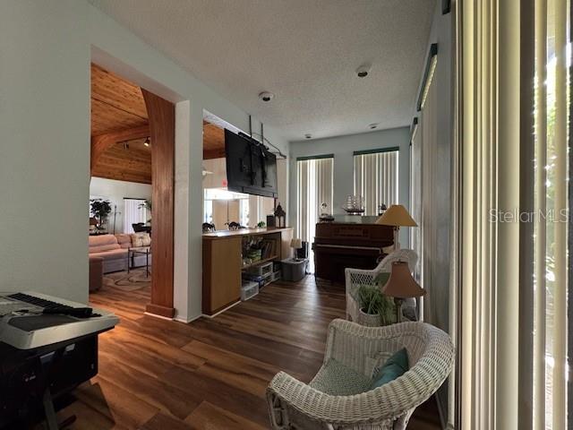 11485 Oakhurst Road, Unit 319 Largo, FL 33774 - Photo 46 of 63 a kitchen with a table chairs refrigerator and a window