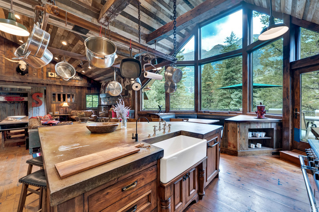 2983 East Ridgetop Road, Unit 27 Provo, UT 84604 - Photo 13 of 63 Chef's kitchen showcasing dual wood-finish islands with apron-front sink, professional-grade cookware storage, and stainless steel pendant lighting