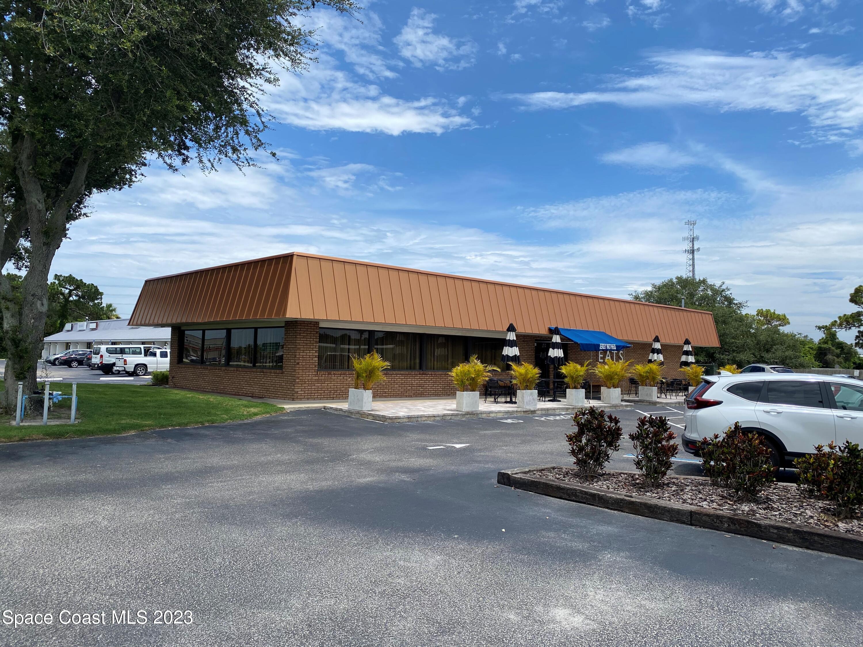 a view of a car park in front of a house