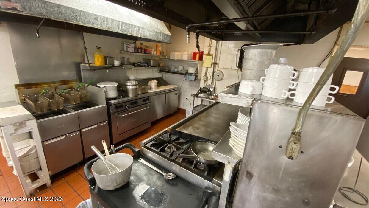 2162 Harris Avenue Northeast Palm Bay, FL 32905 - Photo 8 of 12 a kitchen with a stove and a refrigerator