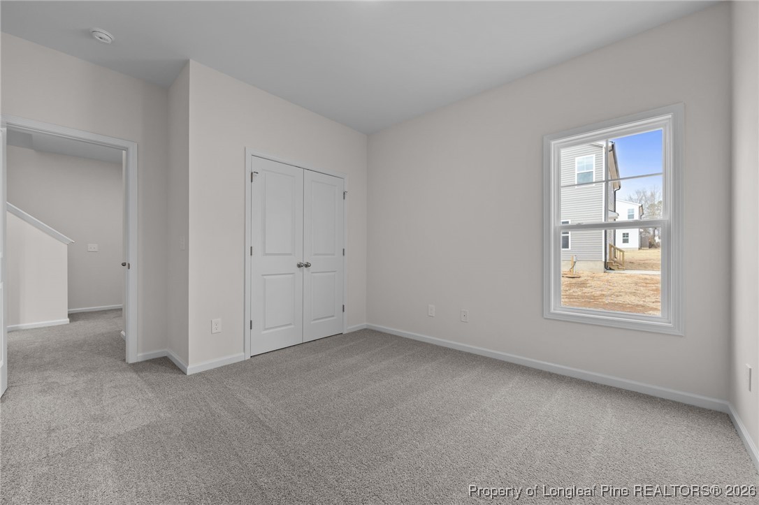 62 Regis Lane Coats, NC 27521 - Photo 14 of 38 an empty room with windows
