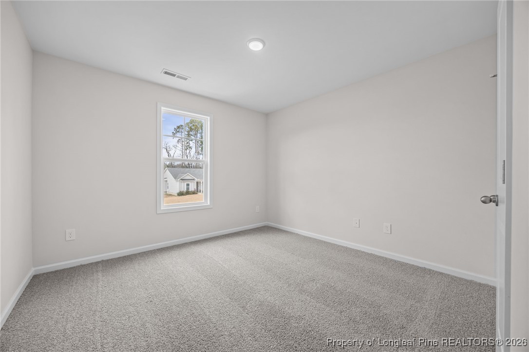 62 Regis Lane Coats, NC 27521 - Photo 16 of 38 an empty room with a window