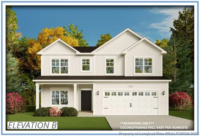 a view of a white house with a yard and potted plants