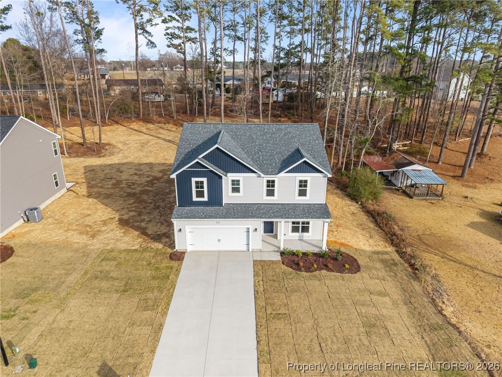 62 Regis Lane Coats, NC 27521 - Photo 2 of 38 a front view of a house with a yard