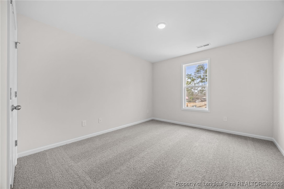 62 Regis Lane Coats, NC 27521 - Photo 22 of 38 an empty room with a window