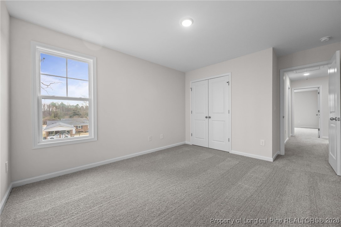 62 Regis Lane Coats, NC 27521 - Photo 25 of 38 an empty room with windows and closet