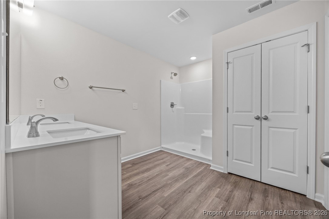 62 Regis Lane Coats, NC 27521 - Photo 29 of 38 a bathroom with a sink and a mirror