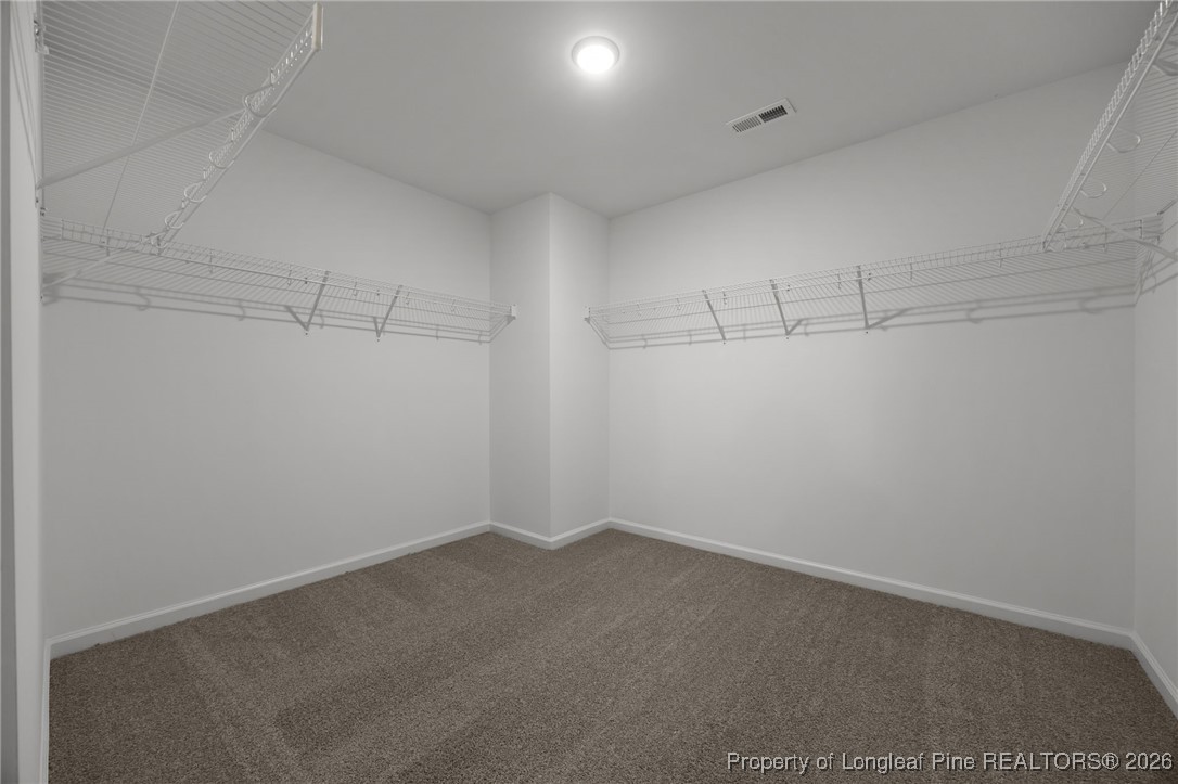 62 Regis Lane Coats, NC 27521 - Photo 31 of 38 a view of a room with racks on the wall