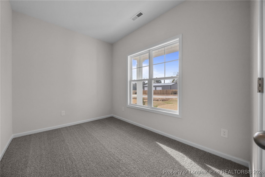 62 Regis Lane Coats, NC 27521 - Photo 5 of 38 a view of an empty room with a window