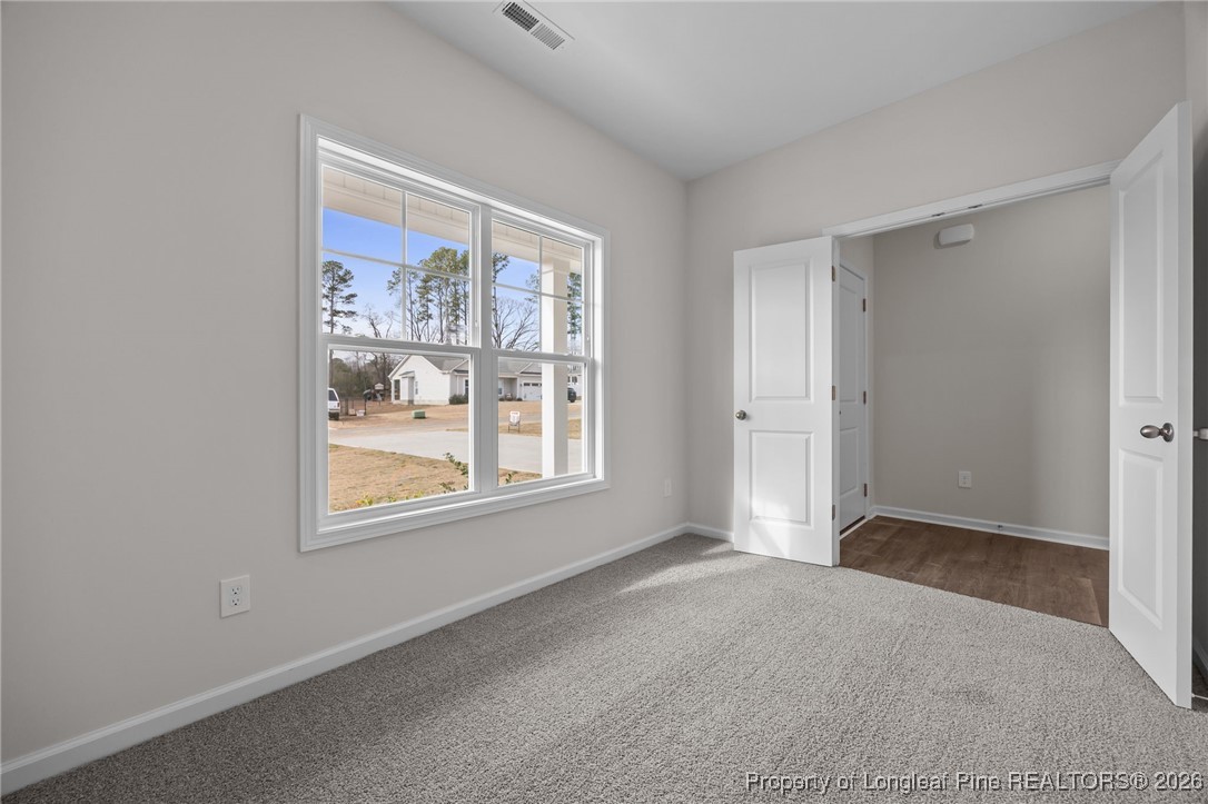 62 Regis Lane Coats, NC 27521 - Photo 6 of 38 an empty room with windows