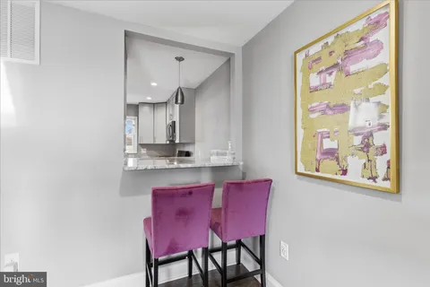 a bathroom with a shower sink vanity mirror and toilet