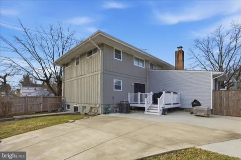 a view of a house with wooden fence