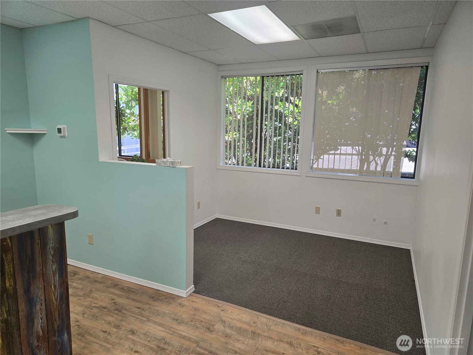 1211 4th Avenue East, Unit 202 Olympia, WA 98506 - Photo 3 of 6 an empty room with windows