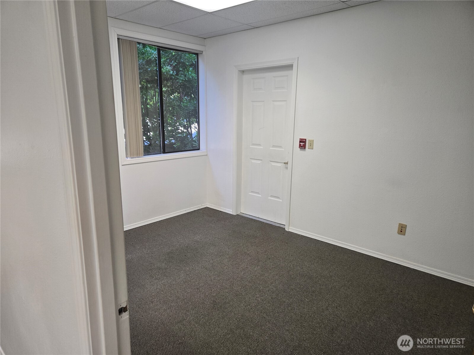 1211 4th Avenue East, Unit 202 Olympia, WA 98506 - Photo 5 of 6 an empty room with windows