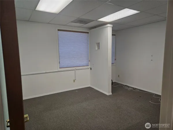 an empty room with windows