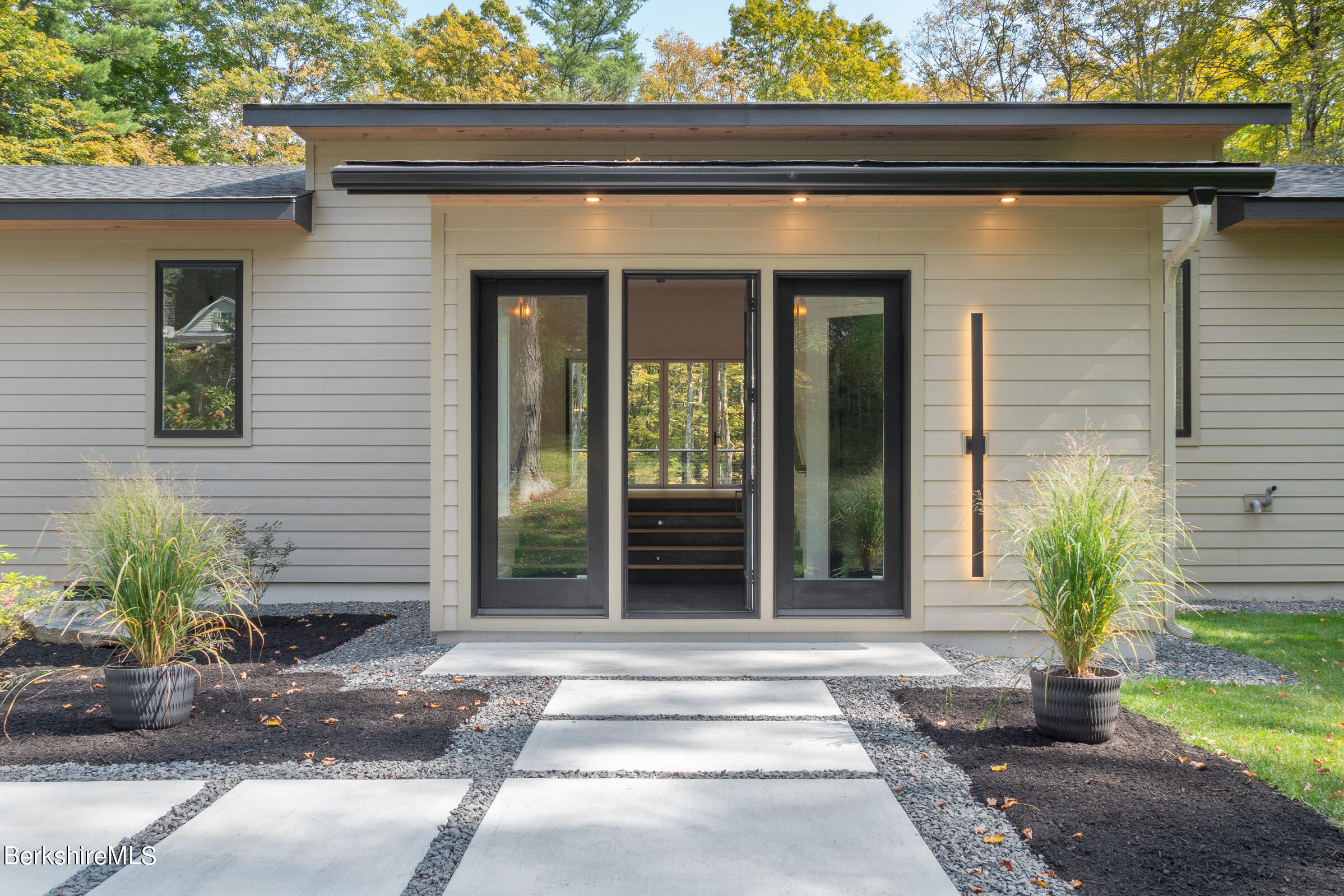 112 Tyringham Road Monterey, MA 01245 - Photo 1 of 57 a front view of a house with a garden