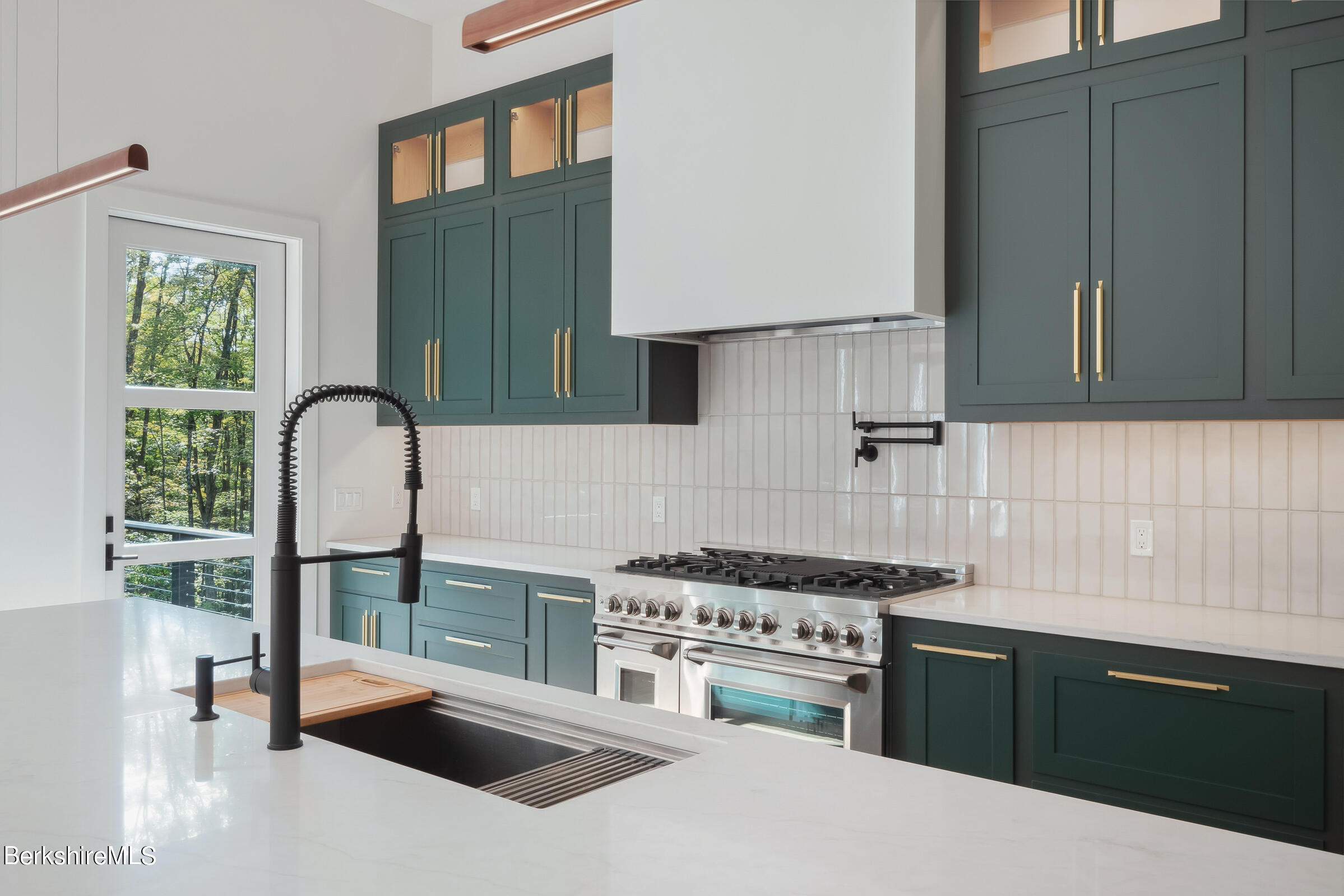 112 Tyringham Road Monterey, MA 01245 - Photo 11 of 57 a kitchen with a stove a sink and a refrigerator