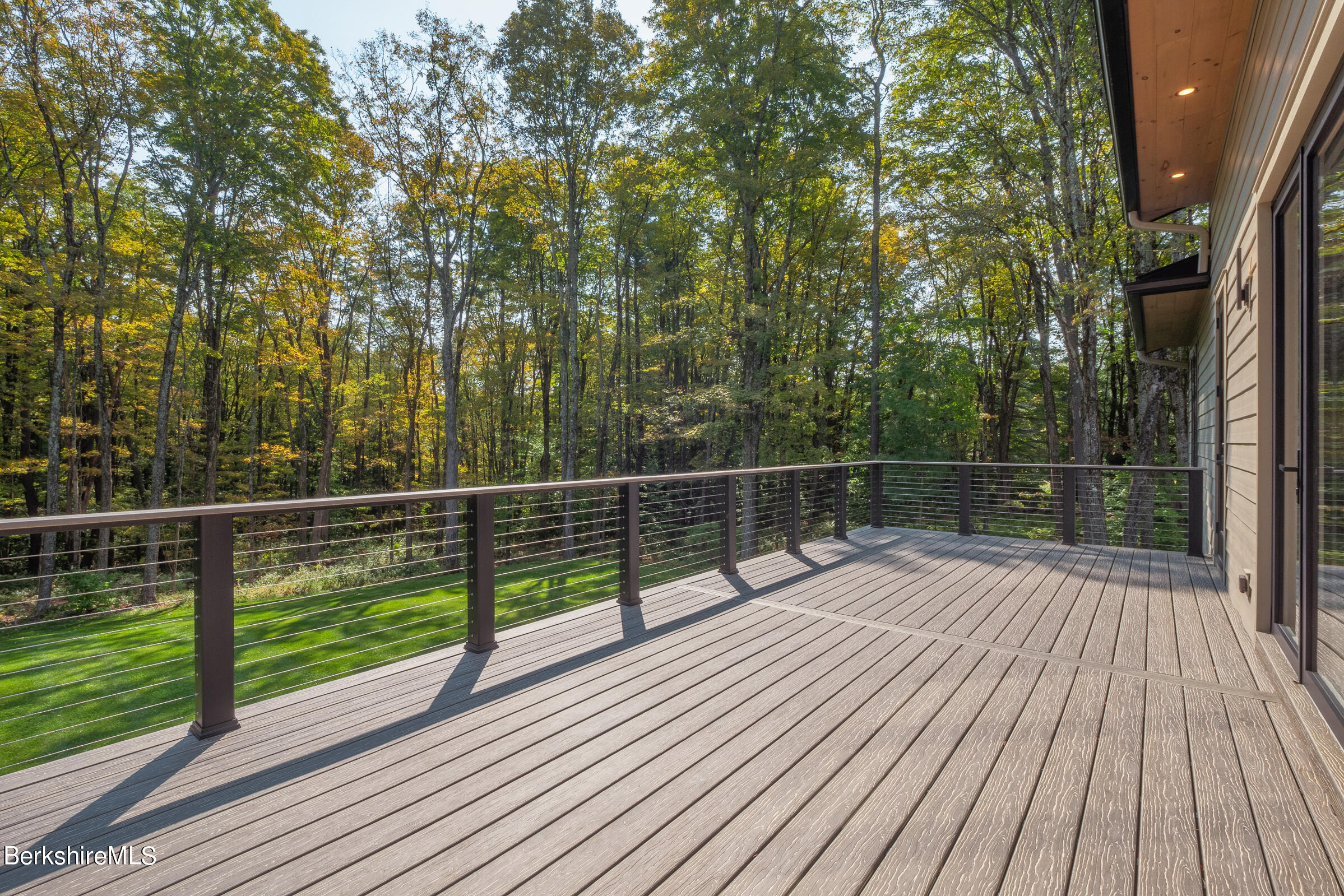 112 Tyringham Road Monterey, MA 01245 - Photo 17 of 57 a view of deck with wooden floor and fence