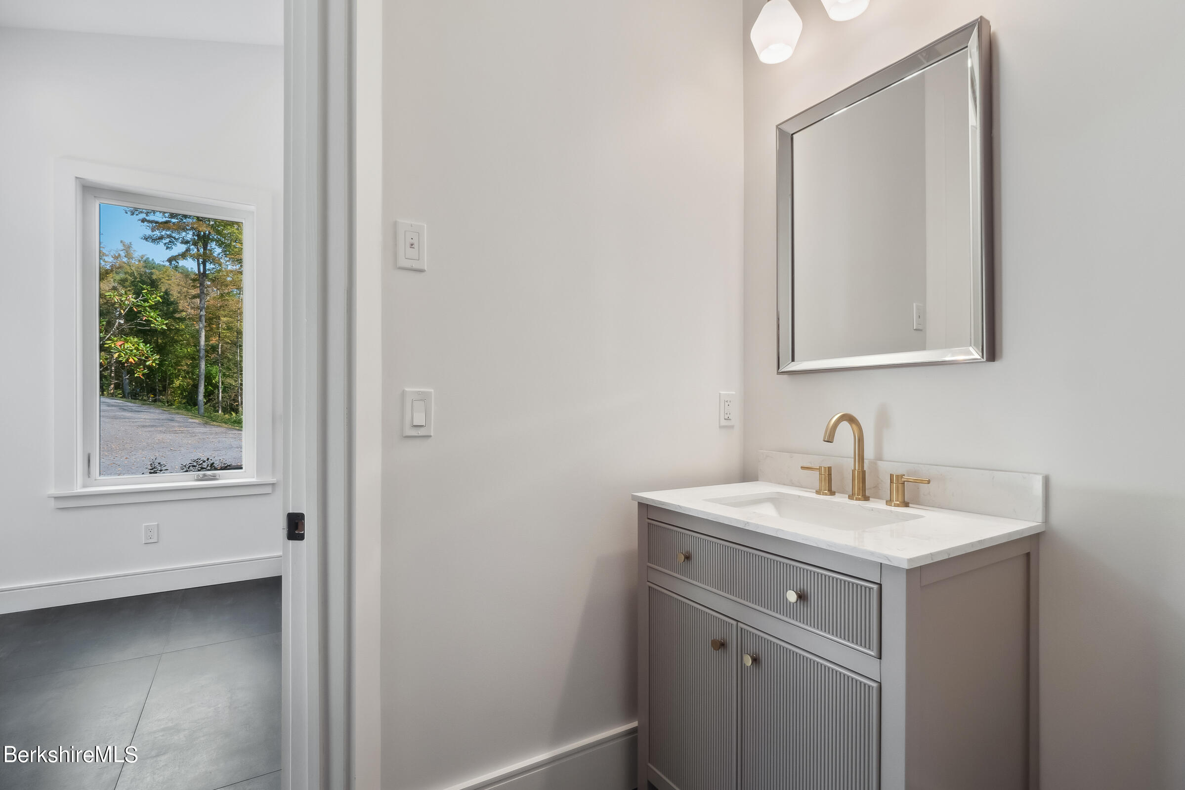 112 Tyringham Road Monterey, MA 01245 - Photo 19 of 57 a bathroom with a sink and a mirror