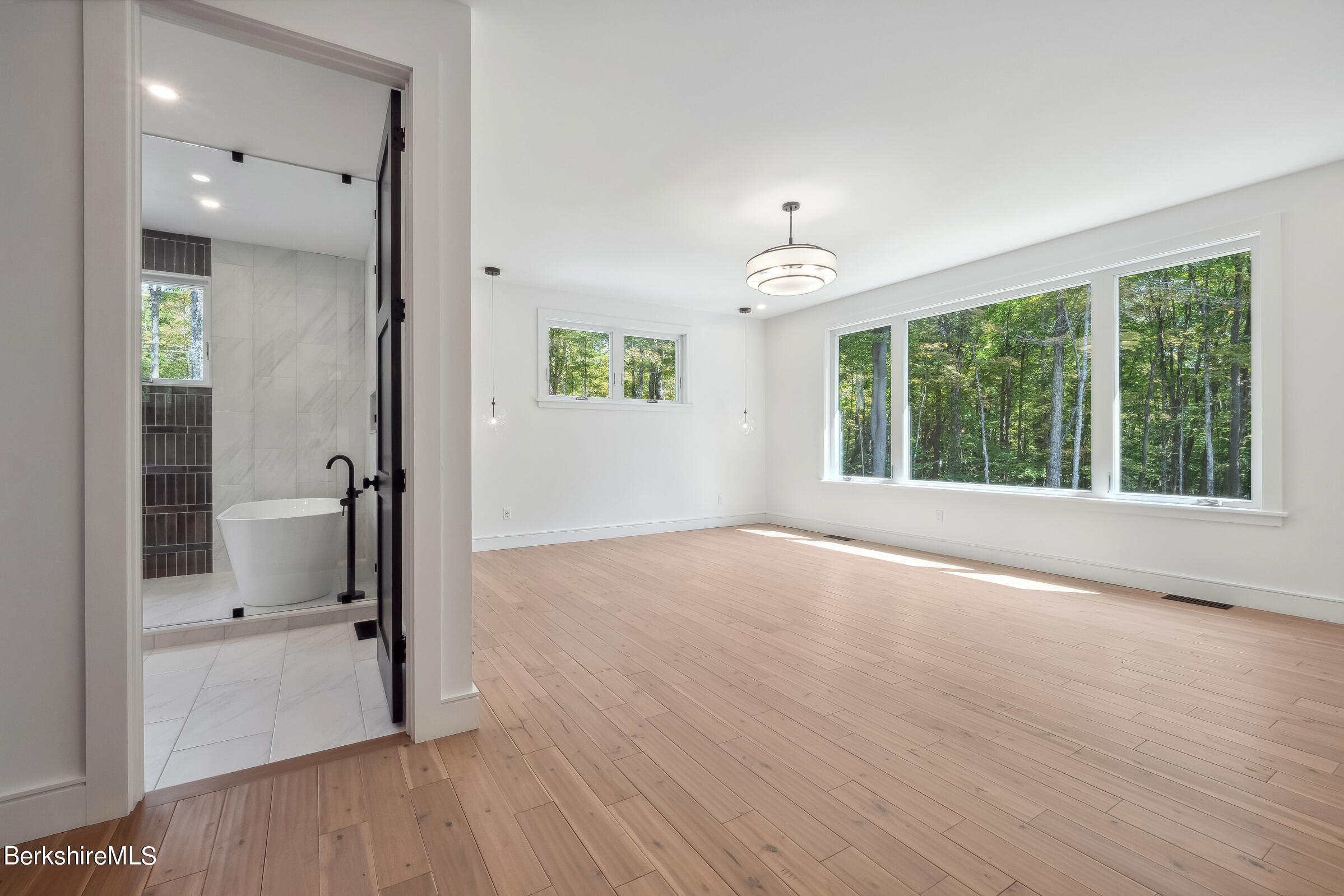 112 Tyringham Road Monterey, MA 01245 - Photo 20 of 57 wooden floor in an empty room with a window