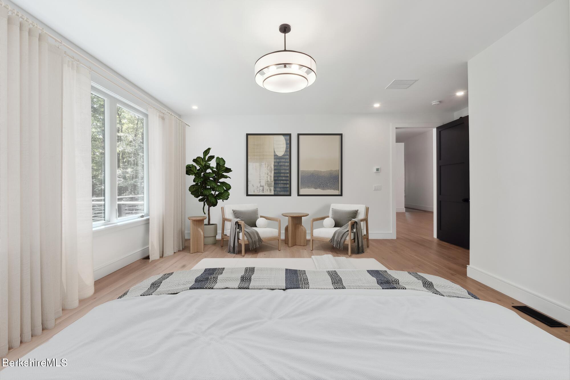 112 Tyringham Road Monterey, MA 01245 - Photo 23 of 57 a living room with furniture and a large mirror