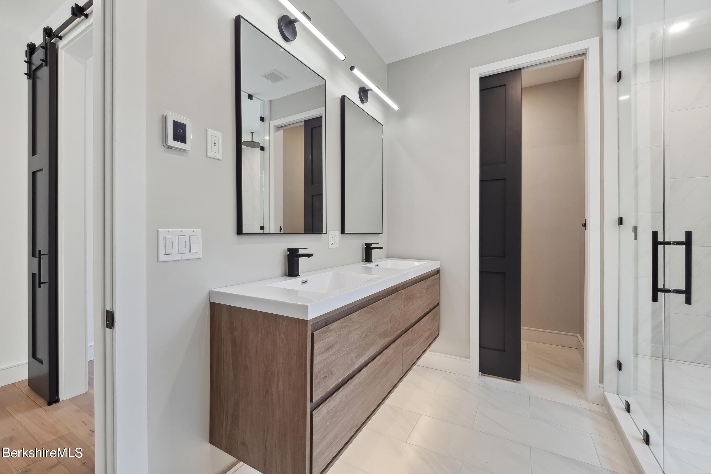 112 Tyringham Road Monterey, MA 01245 - Photo 27 of 57 a bathroom with a sink and a mirror