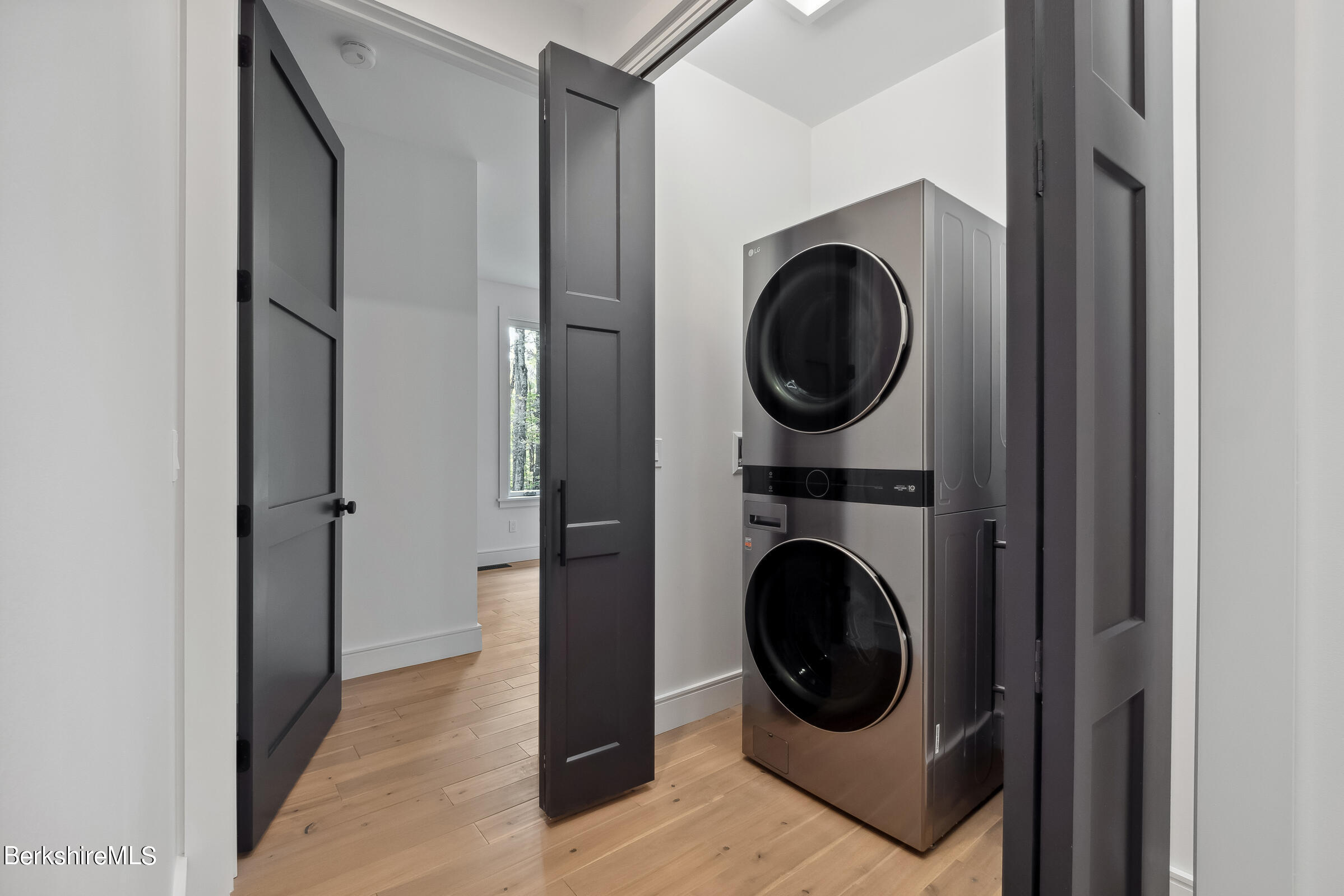 112 Tyringham Road Monterey, MA 01245 - Photo 32 of 57 a view of a hallway with washer and dryer