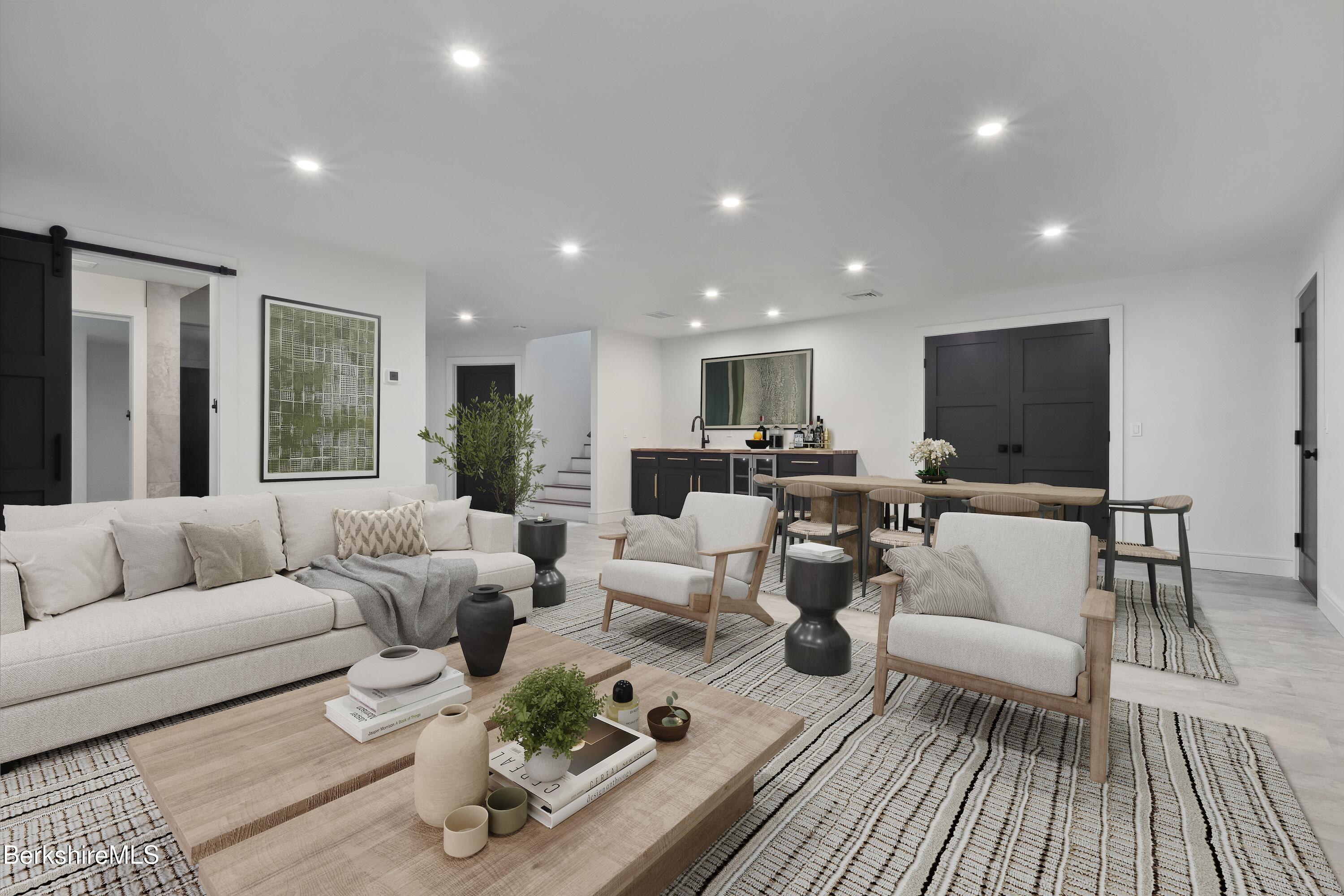 112 Tyringham Road Monterey, MA 01245 - Photo 43 of 57 a living room with furniture and a flat screen tv