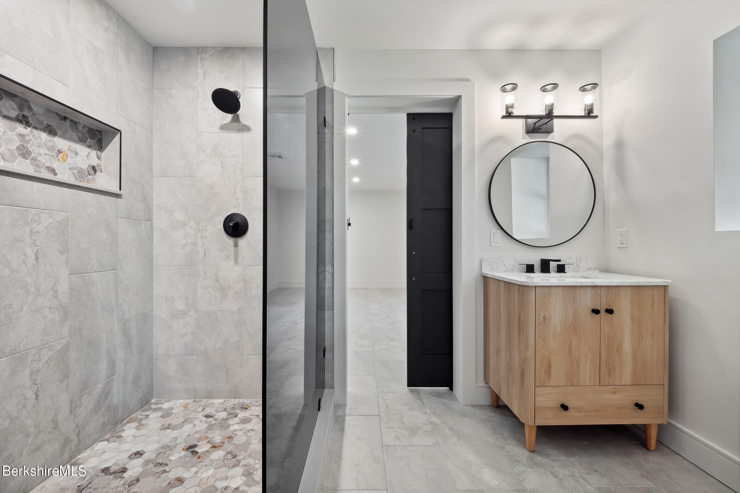 112 Tyringham Road Monterey, MA 01245 - Photo 45 of 57 a bathroom with a sink a mirror and a shower