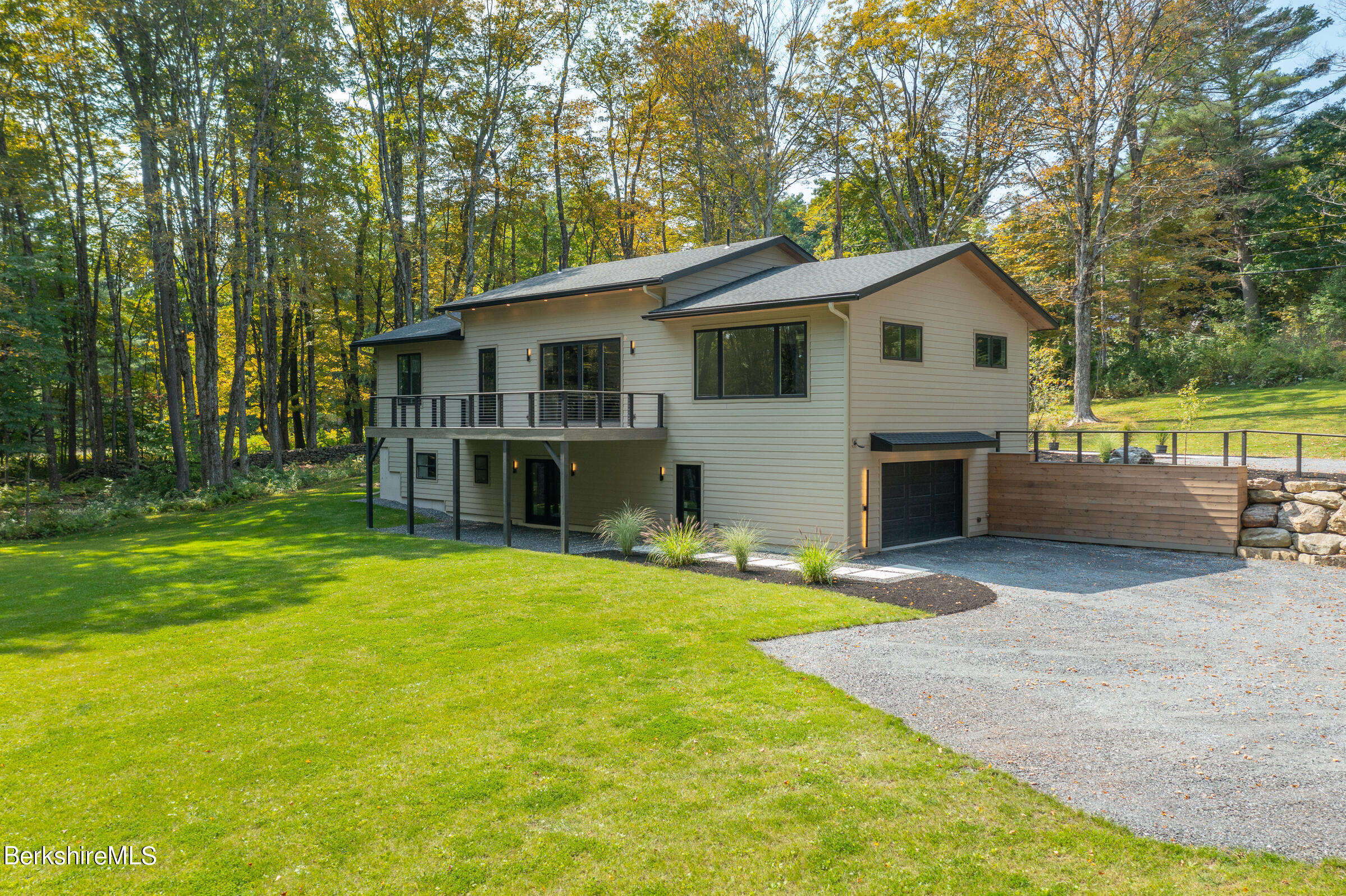 112 Tyringham Road Monterey, MA 01245 - Photo 50 of 57 a view of a house with a patio and a yard