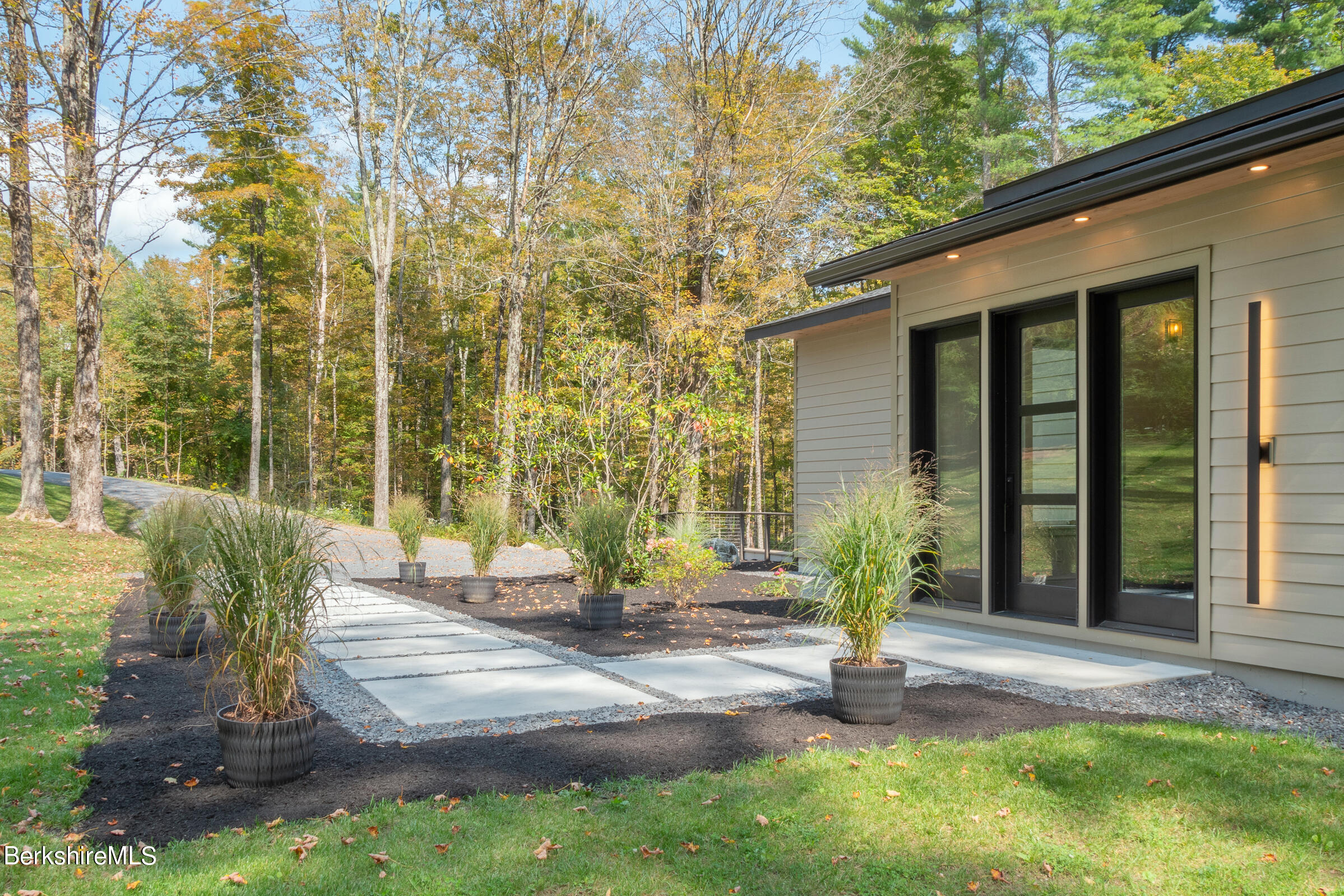 112 Tyringham Road Monterey, MA 01245 - Photo 52 of 57 a view of a house with backyard and sitting area