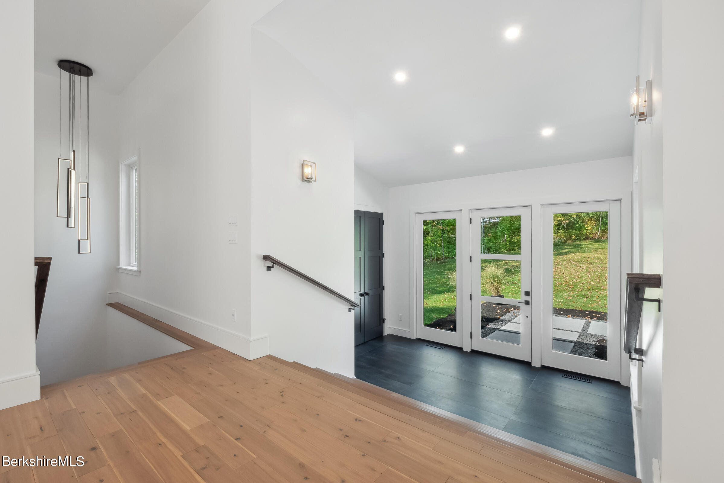 112 Tyringham Road Monterey, MA 01245 - Photo 6 of 57 a view of empty room with wooden floor and fan