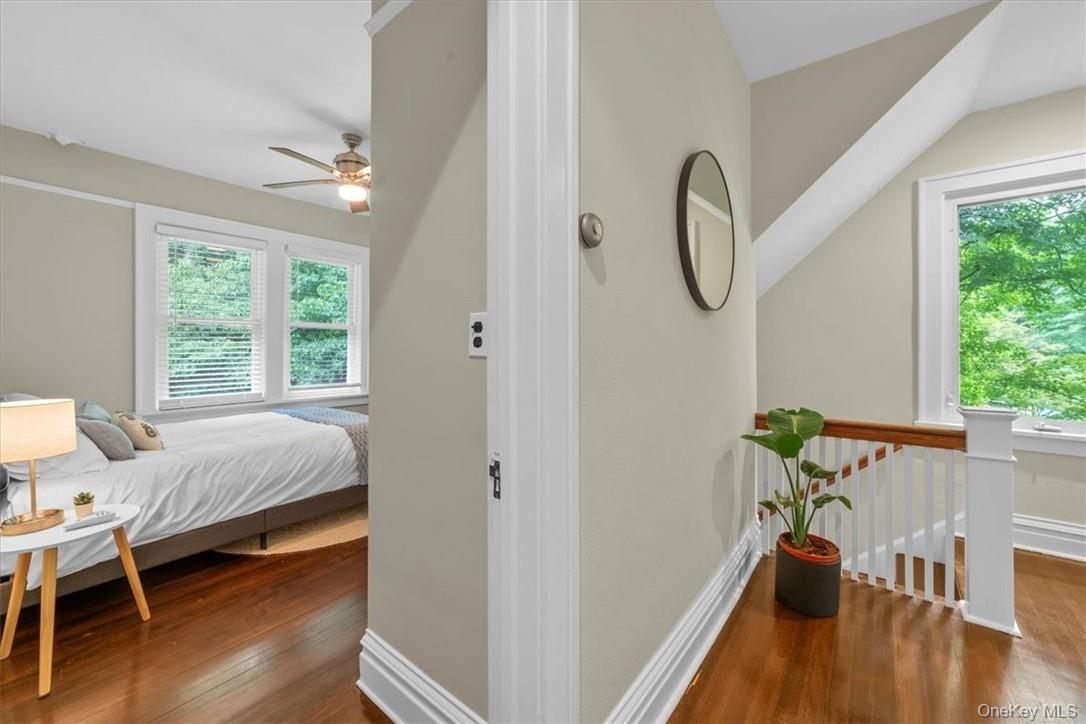 28 Inningwood Road Ossining, NY 10562 - Photo 20 of 37 Bedroom with dark hardwood / wood-style floors, lofted ceiling, multiple windows, and ceiling fan