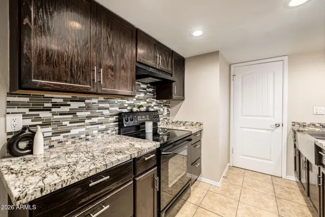 a bed room with a bed and a window