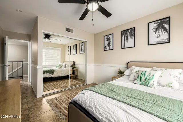 a living room with a flat screen tv and a couch