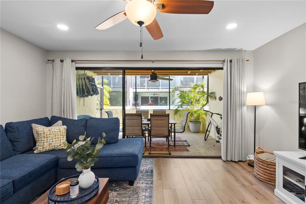 1752 Stickney Point Road, Unit 102 Sarasota, FL 34231 - Photo 19 of 50 a living room with furniture and a large window