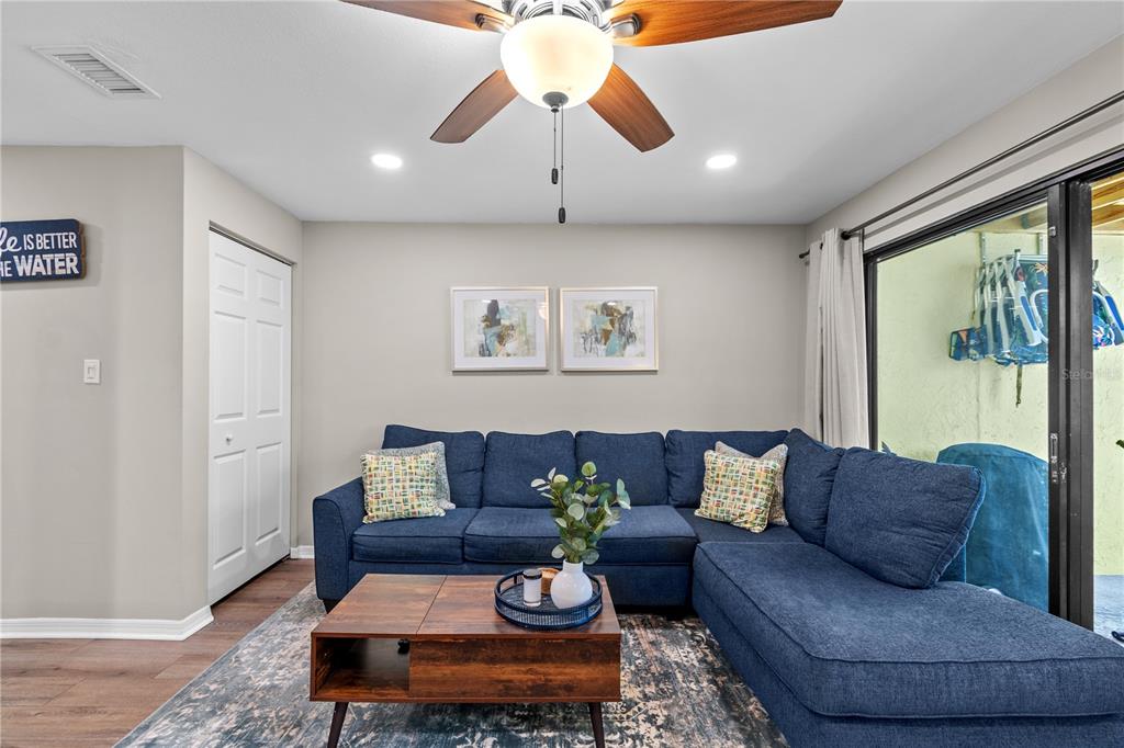1752 Stickney Point Road, Unit 102 Sarasota, FL 34231 - Photo 21 of 50 a living room with furniture and a large window