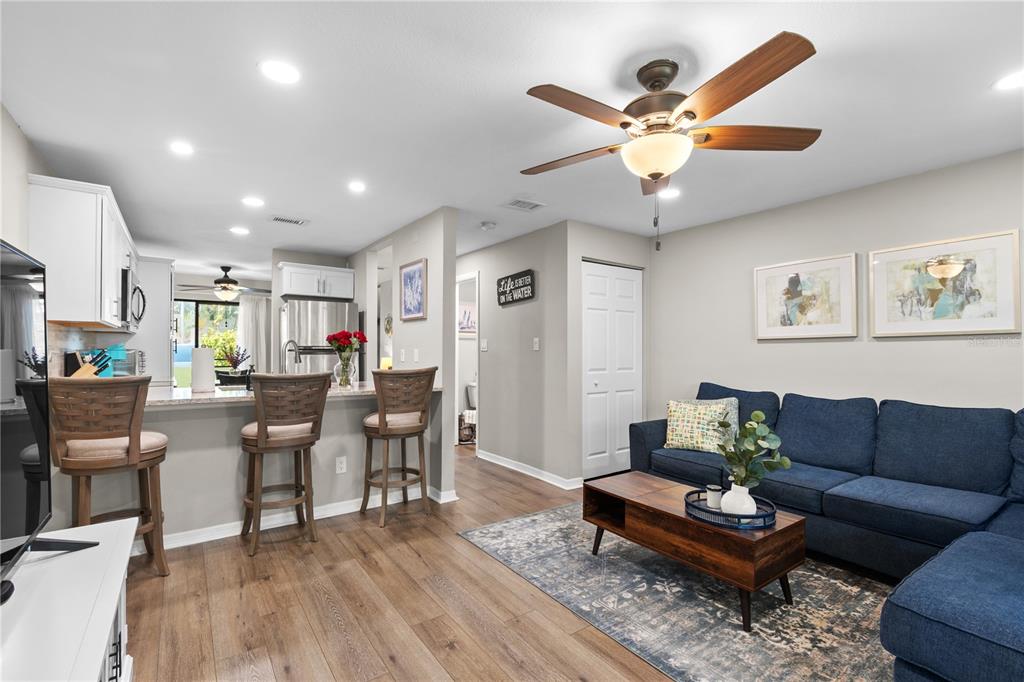 1752 Stickney Point Road, Unit 102 Sarasota, FL 34231 - Photo 22 of 50 a living room with furniture and wooden floor