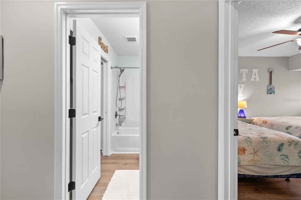 1752 Stickney Point Road, Unit 102 Sarasota, FL 34231 - Photo 28 of 50 a view of a bedroom from hallway