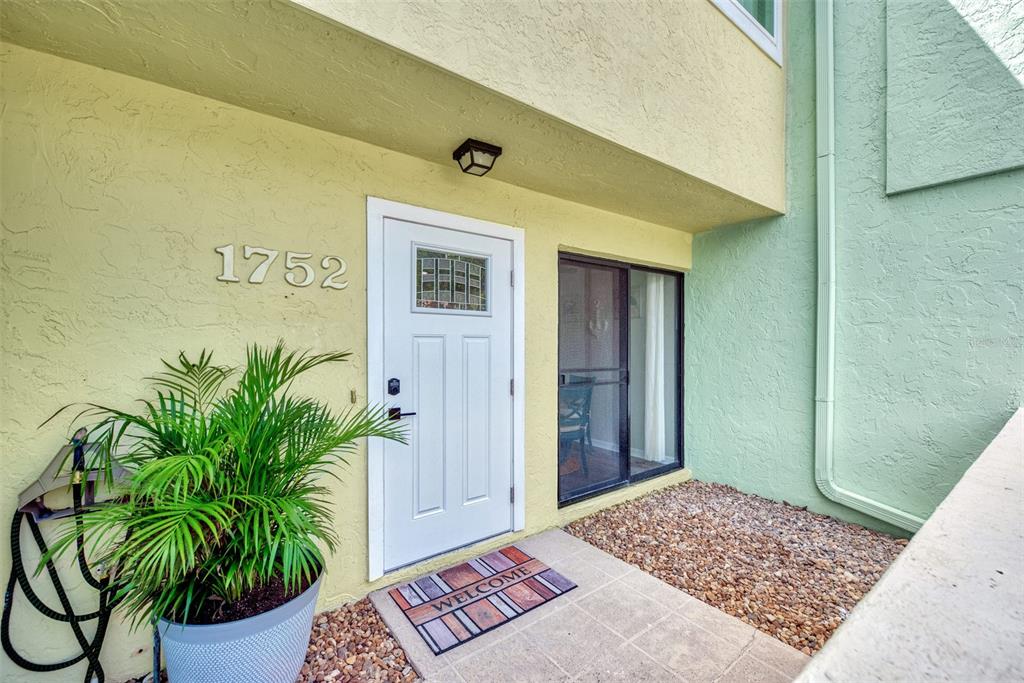 1752 Stickney Point Road, Unit 102 Sarasota, FL 34231 - Photo 3 of 50 a view of entryway with a rug