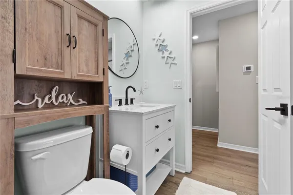 a view of a bathroom from a hallway