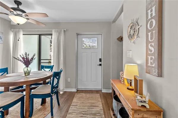 a dining room with a table and chairs