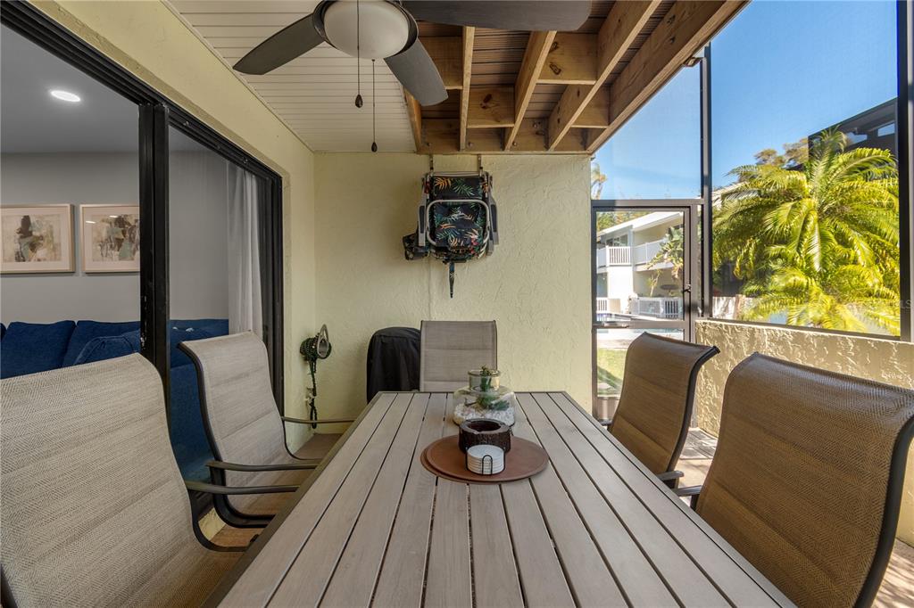 1752 Stickney Point Road, Unit 102 Sarasota, FL 34231 - Photo 43 of 50 a living room with furniture and a wooden floor